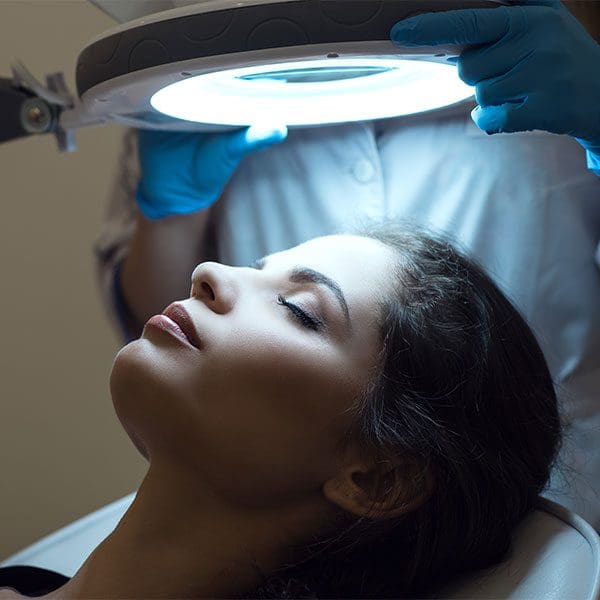 Lady being examined for purpose of lip rejuvenation